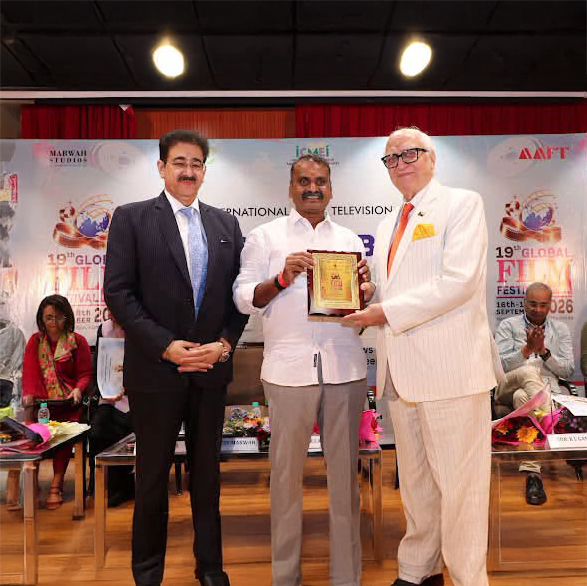 Cdr. K. L. Ganju Presented with Festival Memento by Dr. L. Murugan at 19th Global Film Festival Noida